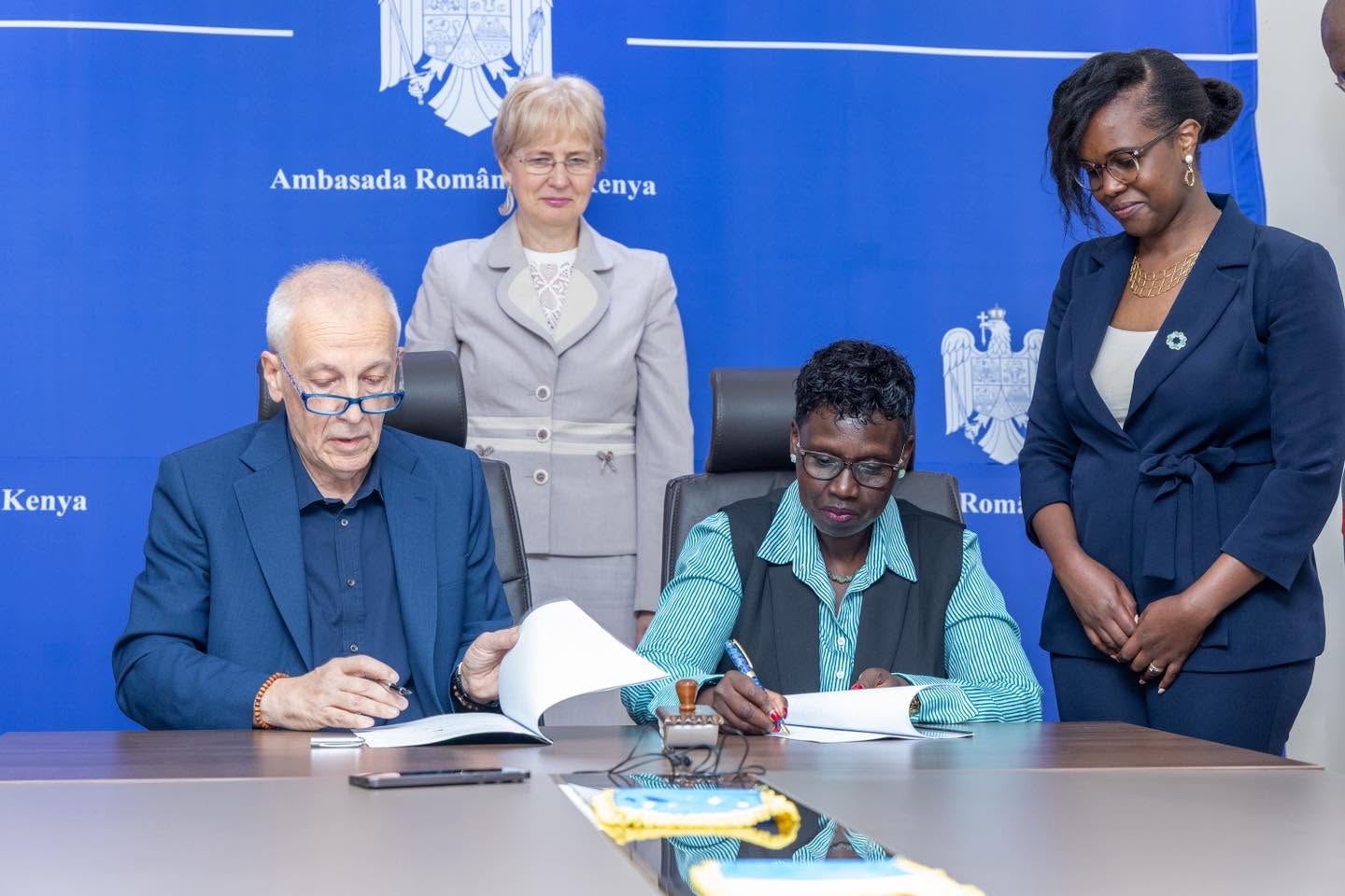 Ambassador Gentiana Serbu and a MaMa Doing Good representative sign the Kenya House Romania partnership at the Romanian Embassy in Nairobi